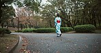 Back, walking and Japanese woman with traditional clothes, fresh air and wellness with hobby, routine and activity. Person, nature and girl with culture, peaceful and calm with adventure and journey