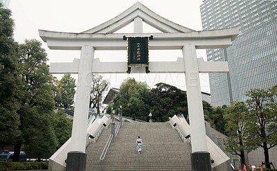 Buy stock photo Back, shrine and steps with Japanese woman walking in city temple for belief, faith or religion. Building, worship and location with person on stairs in Tokyo for tradition, mindfulness or adventure