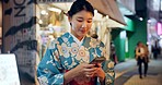 Street, Japanese woman and cellphone with typing, internet or social media with traditional clothes. Person, outdoor or girl with smartphone, mobile user or contact with network, smile or digital app