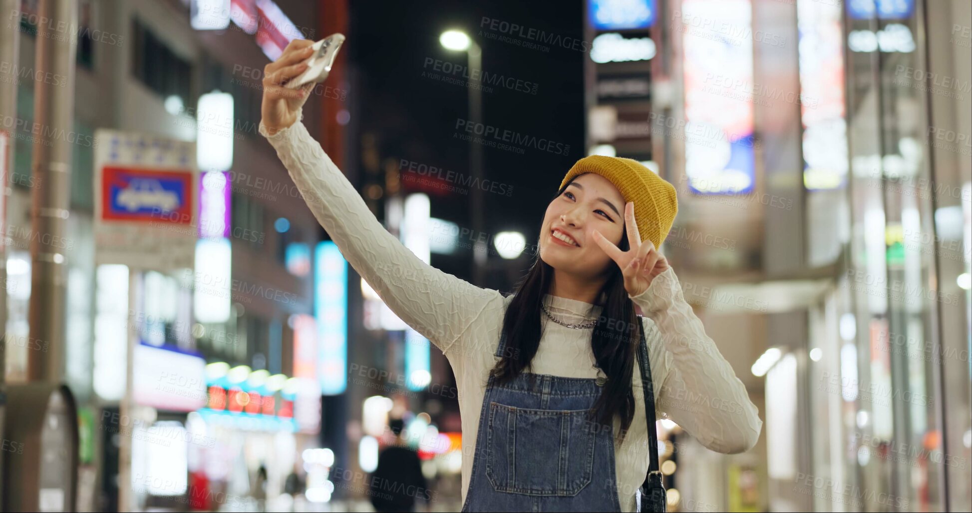 Buy stock photo Peace, hands and selfie by Japanese woman in a city for travel, adventure or journey outdoor. V sign, emoji or happy lady influencer in Japan for content creation, blog or social media live streaming