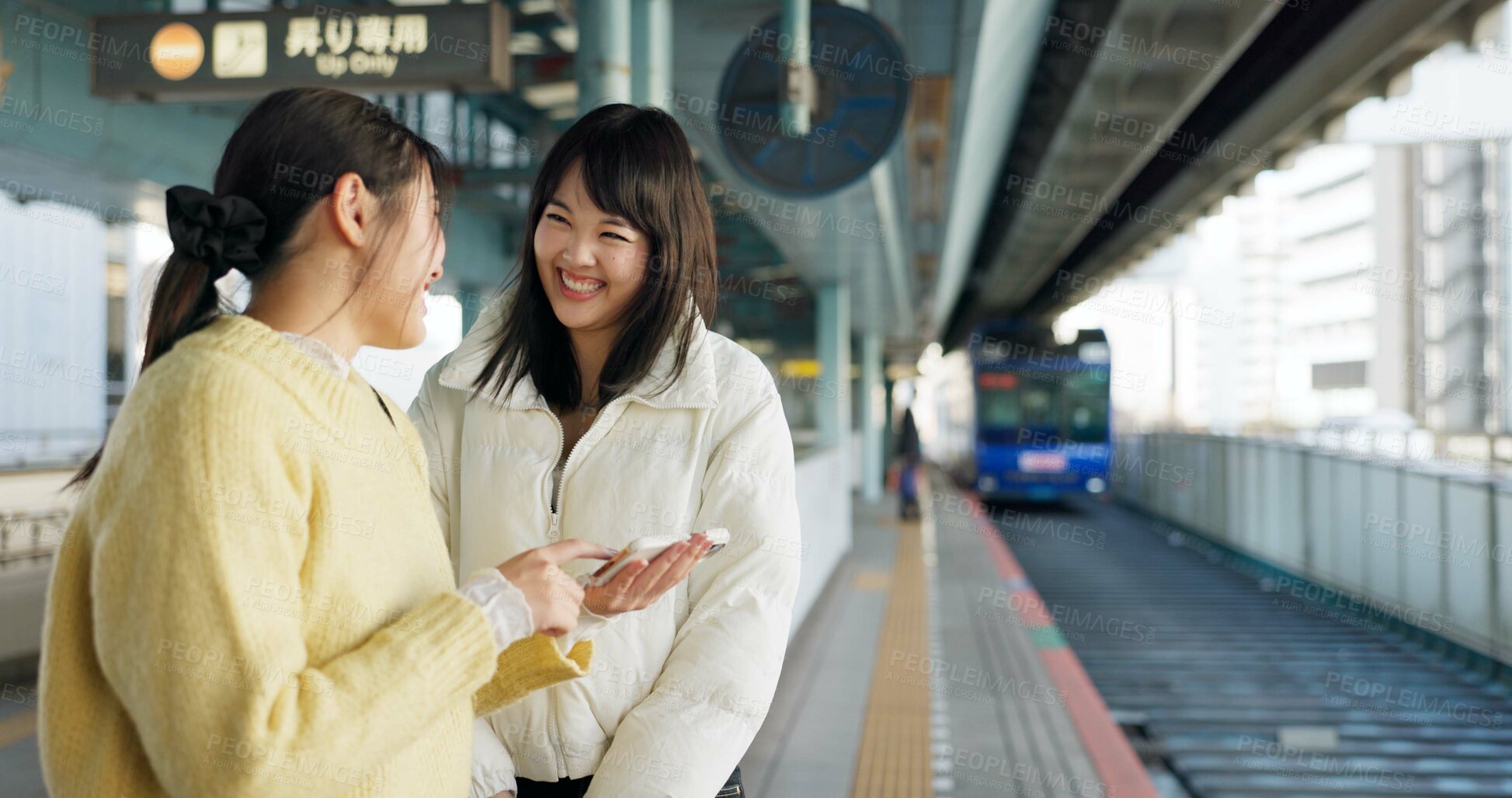 Buy stock photo Women, friends and train station or cellphone or Japanese, travel or social media. Female people, digital device and communication in Tokyo for public transport or vacation commute, urban or journey