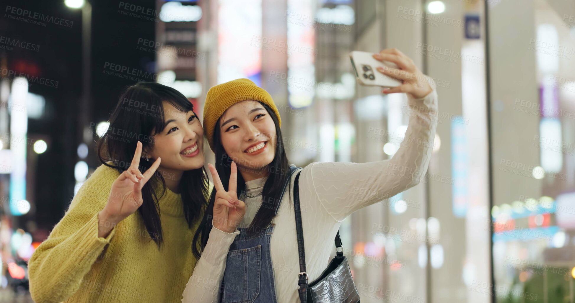 Buy stock photo Friends, Japanese and selfie with women, happy and excited with adventure, profile picture and social media. People, smartphone or girls with night, fun and bonding together with pose and peace sign