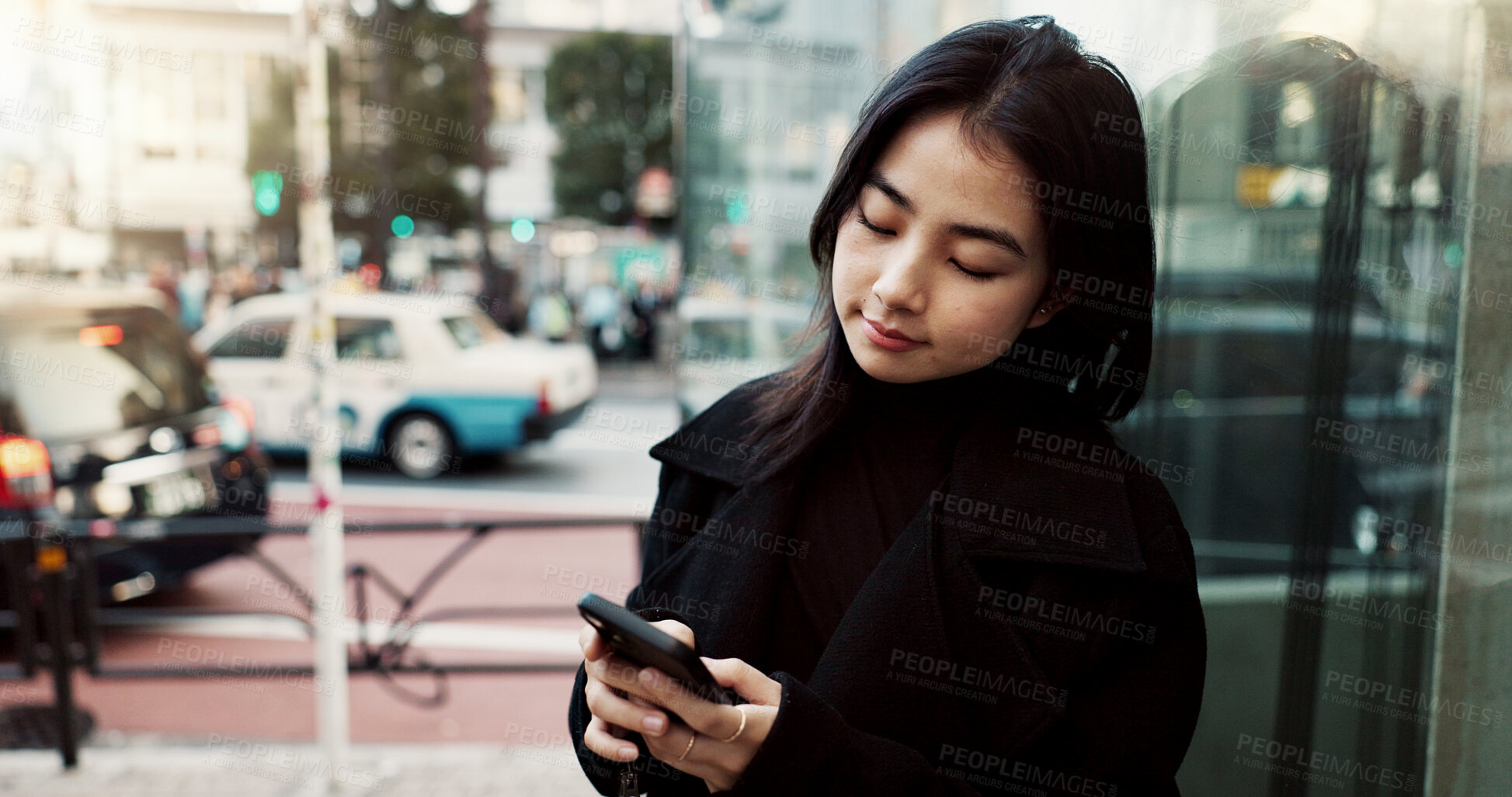 Buy stock photo Phone, city and Japanese woman on social media, reading email or notification in Tokyo. Smartphone, girl and person on mobile in urban street outdoor for communication technology, network or internet