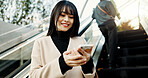 Phone, smile and a Japanese woman on escalator in city, social media app or reading email notification in Tokyo. Smartphone, mobile or happy person in urban street outdoor on communication technology