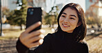 Japanese woman, selfie and smile in park, city or outdoor on web blog, contact or communication. Girl, person and influencer smile for photography, profile picture or memory in nature on social media