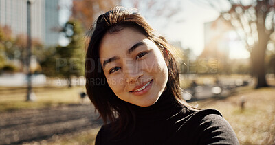 Buy stock photo Japanese woman, smile and selfie in park, nature and path with sunshine, city and buildings with pride. Girl, person and happy in portrait by lawn, grass and trees on urban travel, outdoor and Tokyo