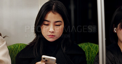 Buy stock photo Japanese, woman on train for travel and smartphone, social media and communication, scroll online and chat on commute. Adventure, urban and metro with traveller on subway and connection in Tokyo