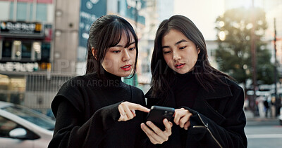 Buy stock photo Phone, friends and women in city for travel, social media and connection together in Japan. Smartphone, girls and people in urban street outdoor on app, information or network on technology in Tokyo