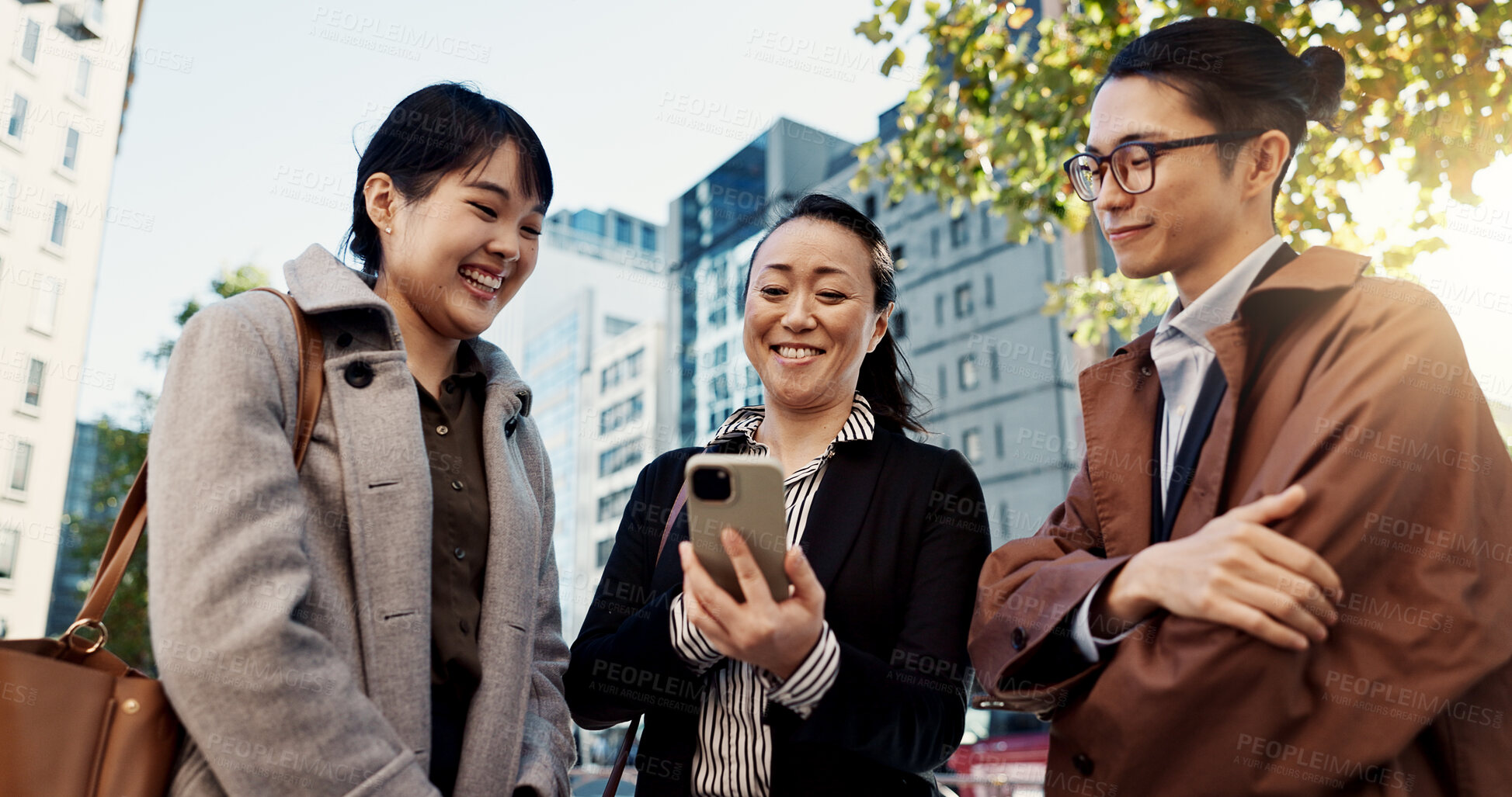 Buy stock photo Phone, smile and Japanese business people in city for travel, communication or networking together. Collaboration, internet or email with happy employee group outdoor for commute in Tokyo town