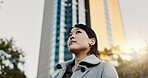Thinking, city and business Japanese woman with music on morning commute, travel and walking in Tokyo. Earphones, corporate worker and person with ideas, ambition and future for career, work and job 