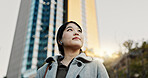 Thinking, city and professional Japanese woman with music on morning commute, travel and walking in Tokyo. Earphones, corporate and person with ideas, ambition and future for career, business or job 