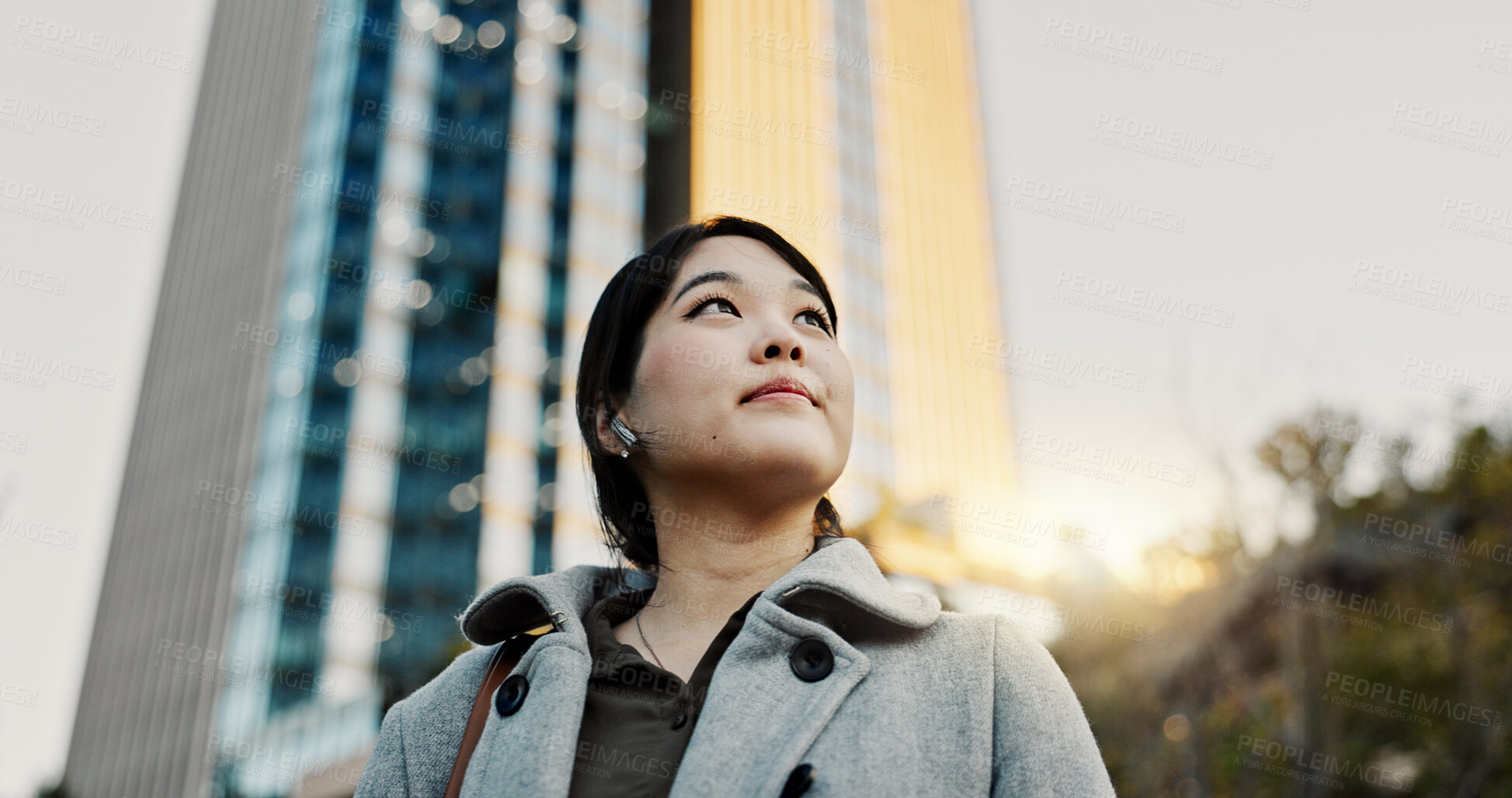 Buy stock photo Thinking, city and professional Japanese woman with music on morning commute, travel and walking in Tokyo. Earphones, corporate and person with ideas, ambition and future for career, business or job 