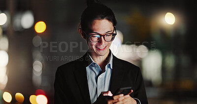 Businessman, cellphone and typing in city at night for company travel opportunity, accomplishment or employment Asian person, smile and texting in urban Tokyo as lawyer or communication, work or chat