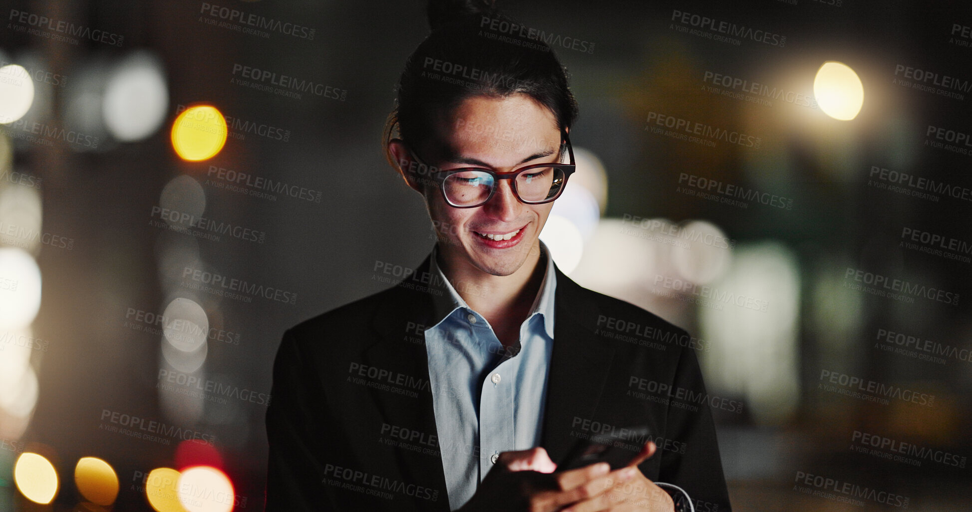 Buy stock photo Businessman, cellphone and typing in city at night for company travel opportunity, accomplishment or employment. Asian person, smile and texting in urban Japan as lawyer or communication for work