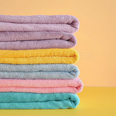 Hotel towel, laundry and clean fabric background for laundromat business, detergent or hygiene. Colourful, neat and stacked fluffy textile for washing softener, cleaning service and eco friendly