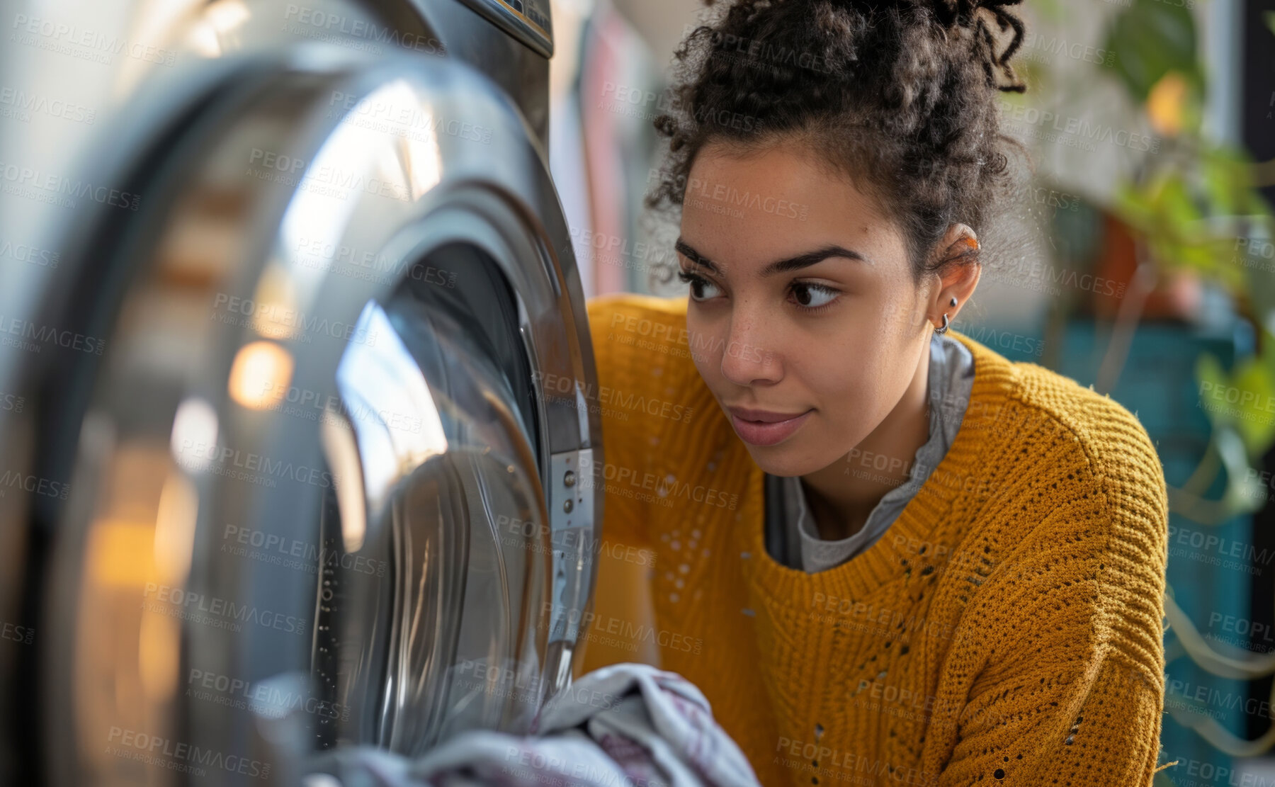 Buy stock photo Woman, laundry and clean clothes loaded into a washing machine for laundromat, chores or self service. Black, young girl or teenager doing cleaning duties for hygiene, cleanliness and housework