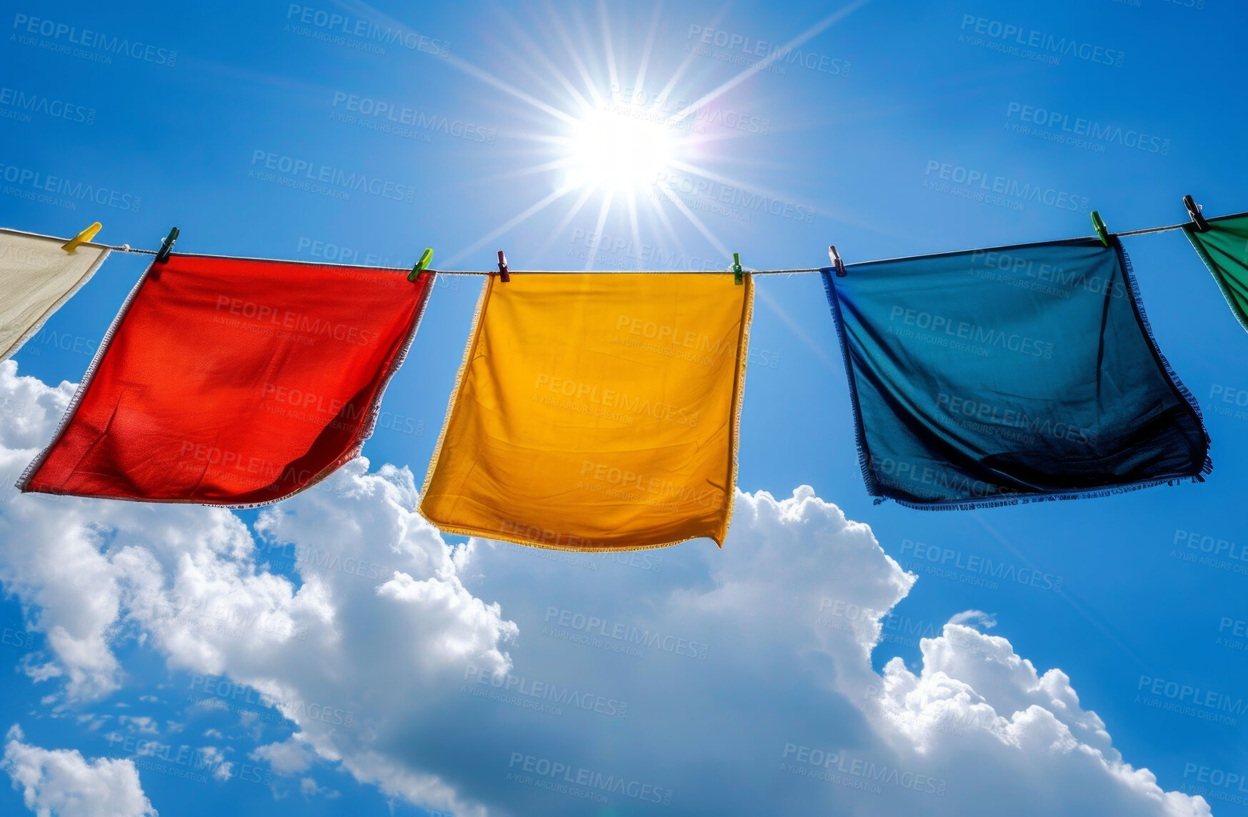 Buy stock photo Cloth, laundry or colourful fabric hanging on a washing line for laundromat business, textile and background. Blue sky, summer day and springtime wallpaper for clean clothes and eco friendly washing