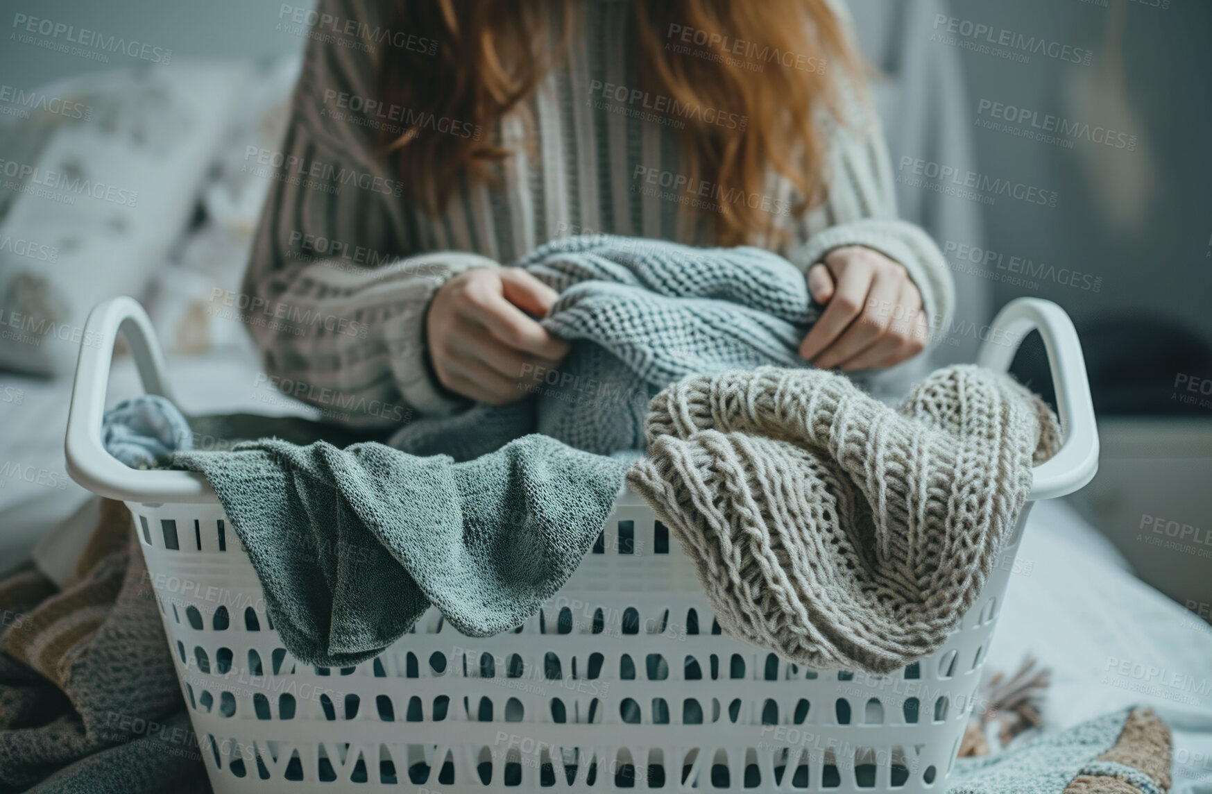 Buy stock photo Cropped woman, clean laundry and clothes in a washing basket at laundromat, home and self service. Fresh, hygienic and closeup of pile of clothing for textile, fabric softener and cleaning duties