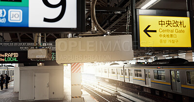 Buy stock photo Railway platform, train and signs with Japanese for commute, travel or journey and transportation. Subway, infrastructure and station with railroad for trip, service or tourism and people in city