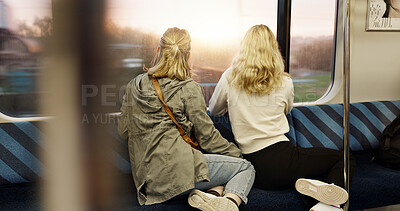 Buy stock photo Women, back view and train window with travel, journey with commute or tourism, transportation and sightseeing. Friends are together, traveller and adventure with trip, public transport and metro