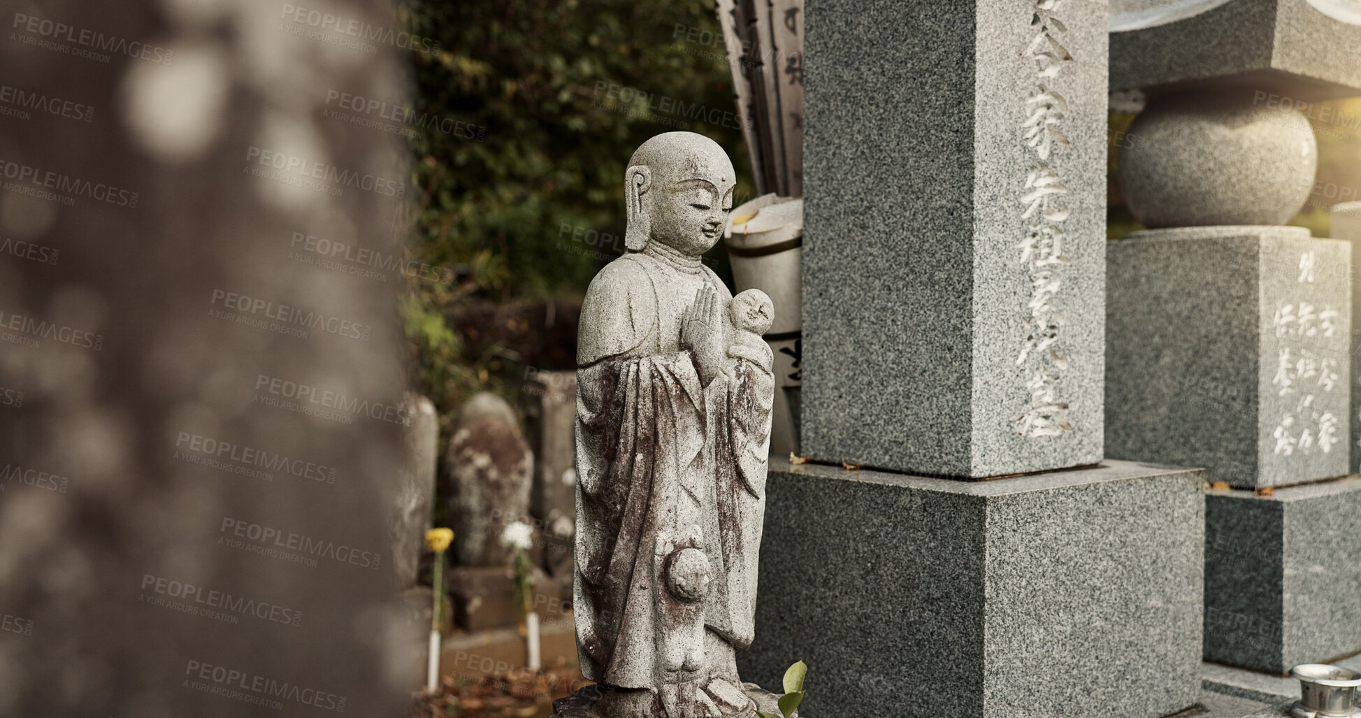 Buy stock photo Buddha, statue and tombstone in graveyard with culture for safety, protection and sculpture outdoor in nature. Jizo, Japan and memorial gravestone with history, tradition and monument for sightseeing