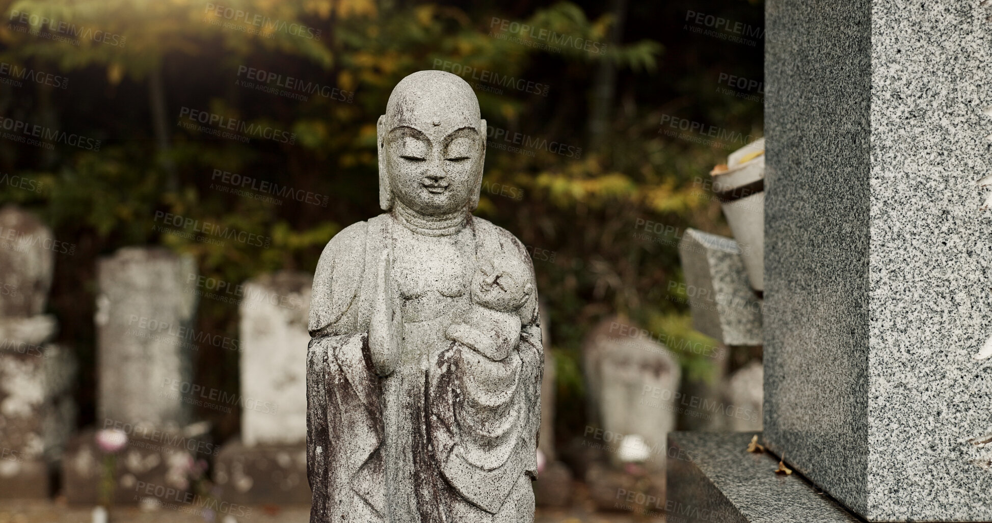 Buy stock photo Buddha, statue in Japan graveyard with child for safety, protection and sculpture outdoor in nature. Jizo, tombstone and memorial gravestone with history, culture and monument for sightseeing or trip