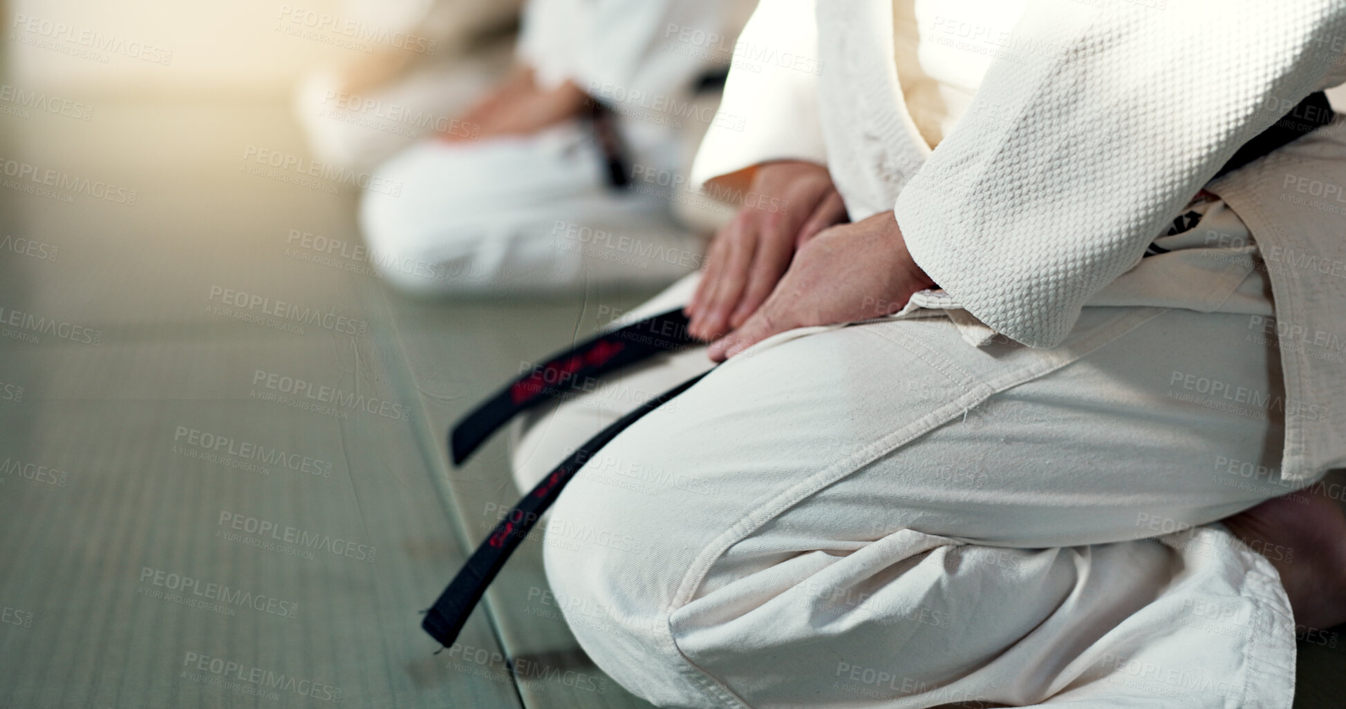 Buy stock photo Japanese men, aikido and bow in training for fighting, modern martial arts and learning self defence. Group, black belt students or instruction in dojo place, sport or class in respect in discipline