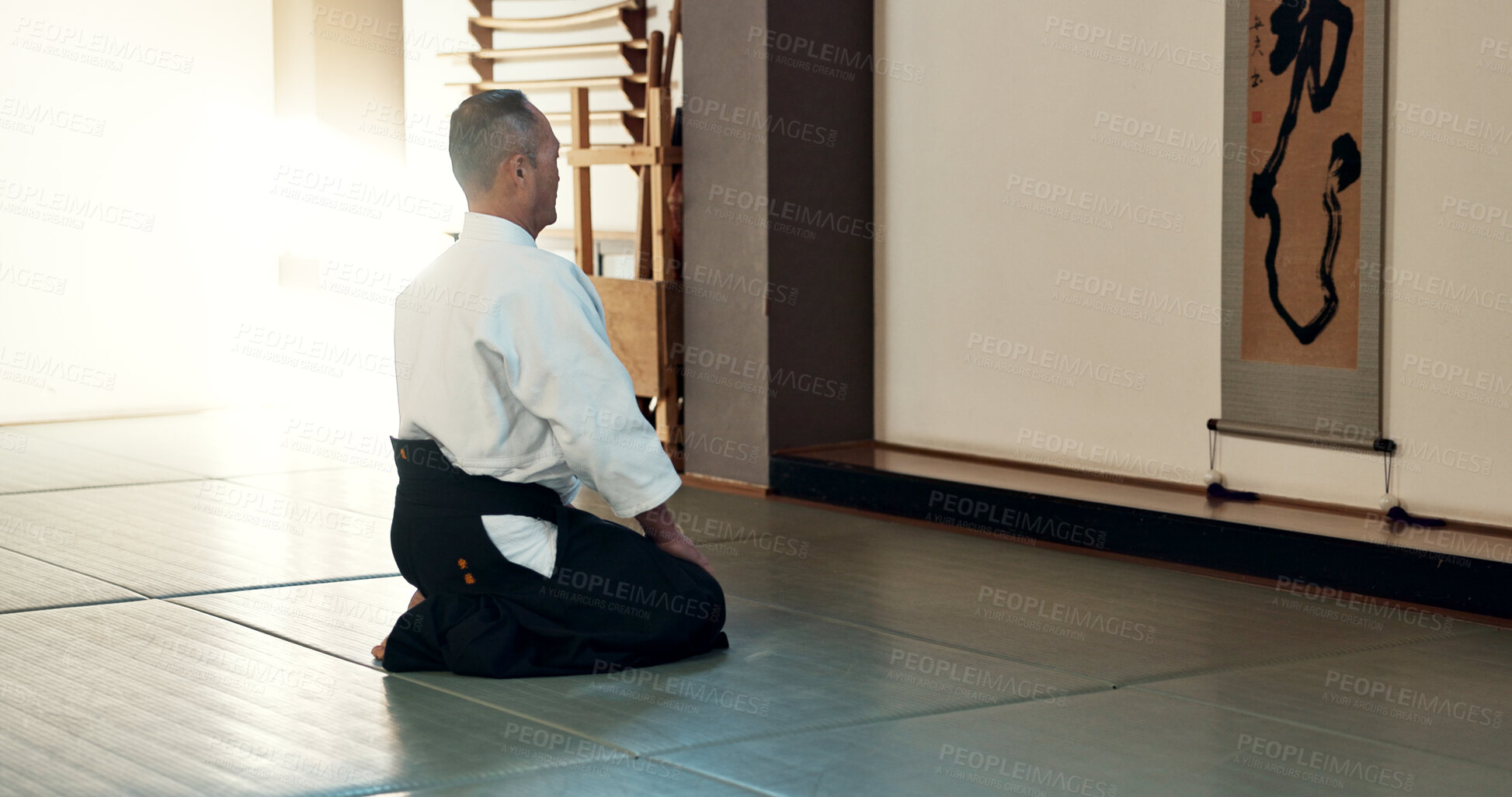 Buy stock photo Asian man, sensei and bow in dojo for honor, greeting or respect to master at indoor gym. Male person or karate trainer bowing in class for etiquette, attitude or commitment in martial arts on floor
