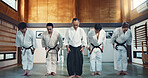 Martial arts group, men and bow at training, respect or honor for fight, conflict or competition in dojo. Senior sensei, Japanese students and together for aikido with exercise, workout or discipline