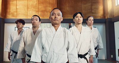 Japanese man, face and sensei in aikido for respect, honor and dignity with group in martial arts class. Portrait of male person or people in commitment for self defense, training or practice at gym