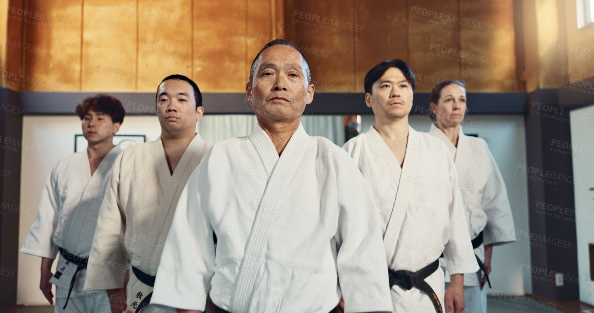 Buy stock photo Japanese man, face and sensei in aikido for respect, honor and dignity with group in martial arts class. Portrait of male person or people in commitment for self defense, training or practice at gym