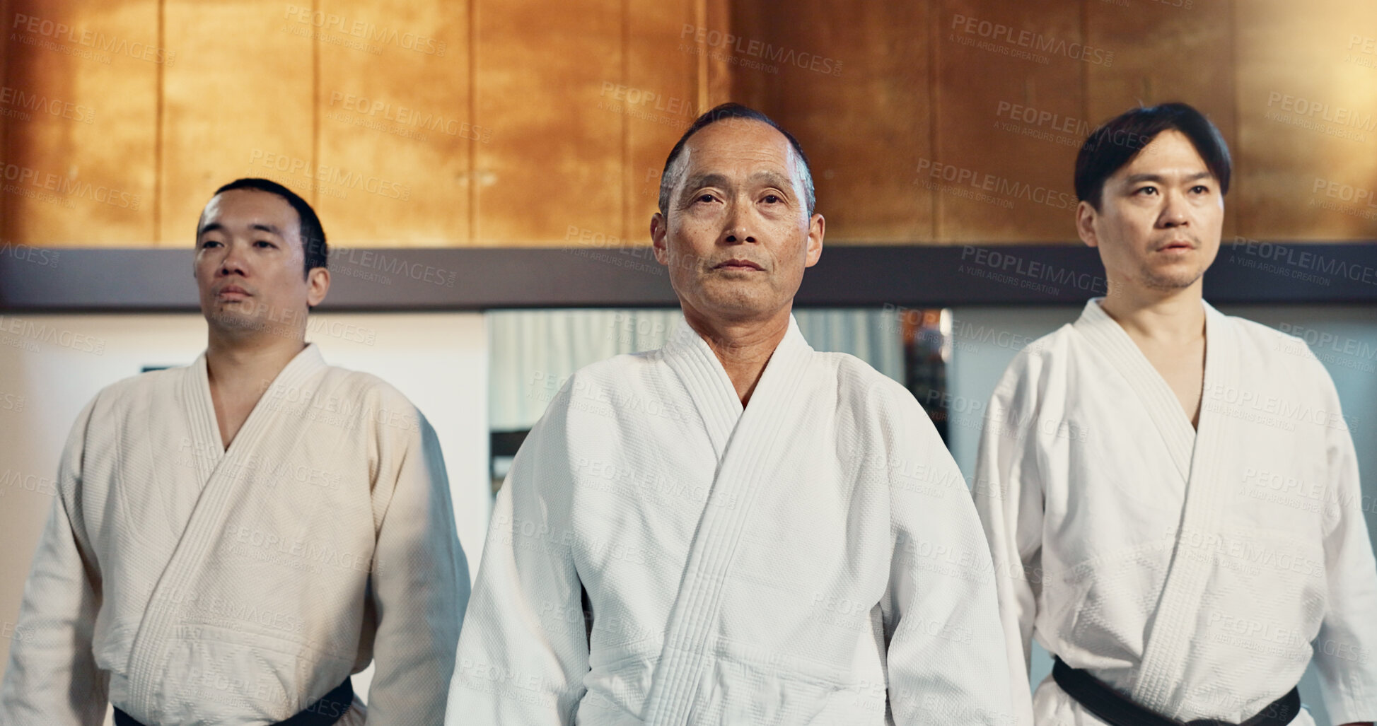 Buy stock photo Japanese man, face and sensei in aikido for respect, honor and dignity with group in martial arts class. Portrait of male person or people in commitment for self defense, training or practice at gym