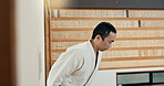 Bow, karate or people in dojo for martial arts for fitness, discipline or self defense for respect or honor. Kung fu, workout or Asian men walking in training for fighting, wellness or combat sports