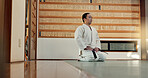 Martial arts man, bow and floor for fight, training or respect with honor for conflict, competition or dojo. Athlete, Japanese person and preparation for aikido with exercise, workout or discipline