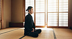 Martial arts man, meditation and exercise in Japanese dojo with mindfulness, zen or chakra balance in morning. Fighter, mma or karate person with peace, breathing and calm for yoga, wellness or floor