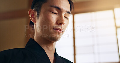 Buy stock photo Thinking, zen and young Asian man with meditation, calm and relaxing face expression at home. Idea, mindfulness and male person with memory, reflection and breathing exercise in modern apartment.