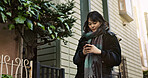 Japanese woman, phone and texting in street, city and typing for contact, email and notification on travel. Girl, person and smartphone for social media, app and mobile networking on road in Tokyo
