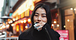 Travel, eating and Asian woman with onigiri in the city on exploring vacation, adventure or holiday.Portrait, food and young female person enjoying a Japanese snack or meal in town on weekend trip.
