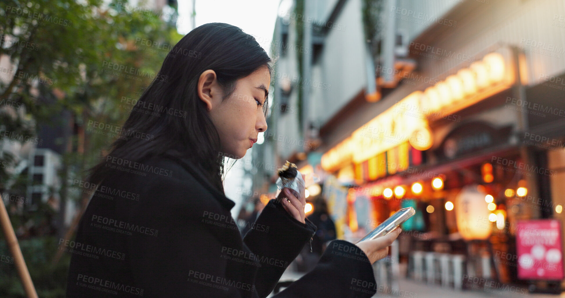 Buy stock photo Phone, eating and Asian woman with onigiri in the city on exploring vacation, adventure or holiday. Hungry, food and young female person enjoying a Japanese snack or meal in town on weekend trip.