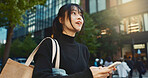 Japanese woman, phone and direction in city with smile, walking or thinking with map by buildings. Person, pedestrian and smartphone with location, schedule or information for address on metro street