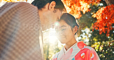 Buy stock photo Couple, forehead touch and sunshine with love in park, Japanese people together on date with love and affection. Lens flare, summer and man with woman outdoor, commitment and loyalty with peace