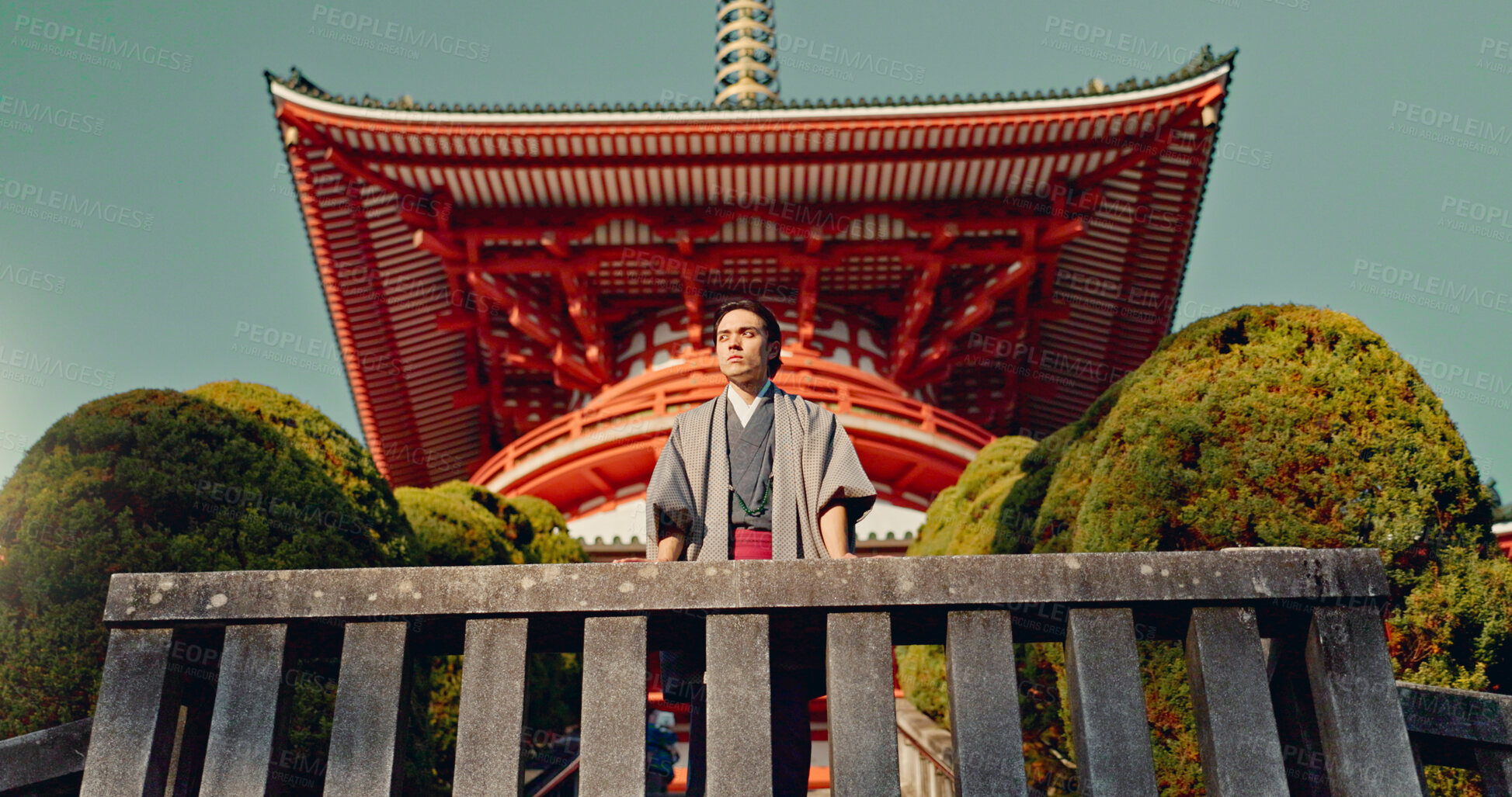 Buy stock photo Man, Japanese shinto temple and traditional clothes for culture, building or religion in sunshine. Person, ideas and vision for perspective with faith, mindfulness or thinking with low angle in Kyoto