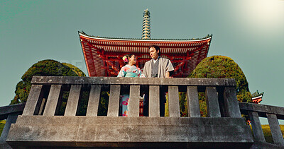 Buy stock photo Man, woman and shinto temple and traditional clothes for culture, building or religion in sunshine. Person, ideas and vision for reflection with faith, mindfulness or buddhism with low angle in Japan
