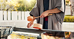 Shinto temple, person and wash hands at fountain, container or cleaning for worship with faith. Religion, mindfulness and purification ritual to stop evil, bacteria or splash ladle at shrine in Tokyo