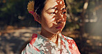 Face, thinking or Asian woman in nature for journey on holiday, vacation for freedom or wellness. Girl, travel or Japanese female person with ideas for calm, peace or inspiration to relax in park