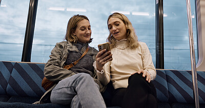 Buy stock photo Happy woman, friends and phone on train for social media, communication or networking in public transport. Female person or people talking with mobile smartphone for online search on railway ride