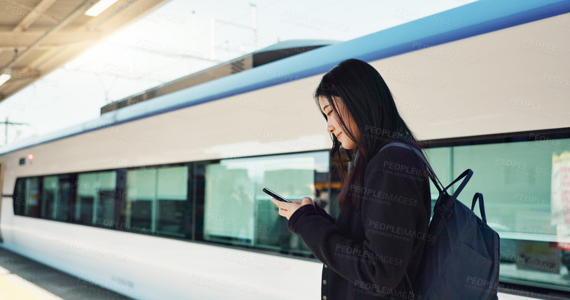 Buy stock photo Woman, phone and outdoor, city or train for travel information, schedule or social media in Japan. Asian student thinking with backpack and mobile search for location, metro or subway transportation