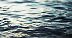 Water, ripple and nature with environment and lake, river or ocean with waves, calm and closeup. Earth, sea and natural background, moving liquid is tranquil and abstract with texture and light