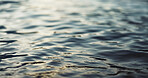 Water, ripple and nature with environment and lake, river or ocean with waves, calm and closeup. Earth, sea and natural background, moving liquid is tranquil and abstract with texture and light