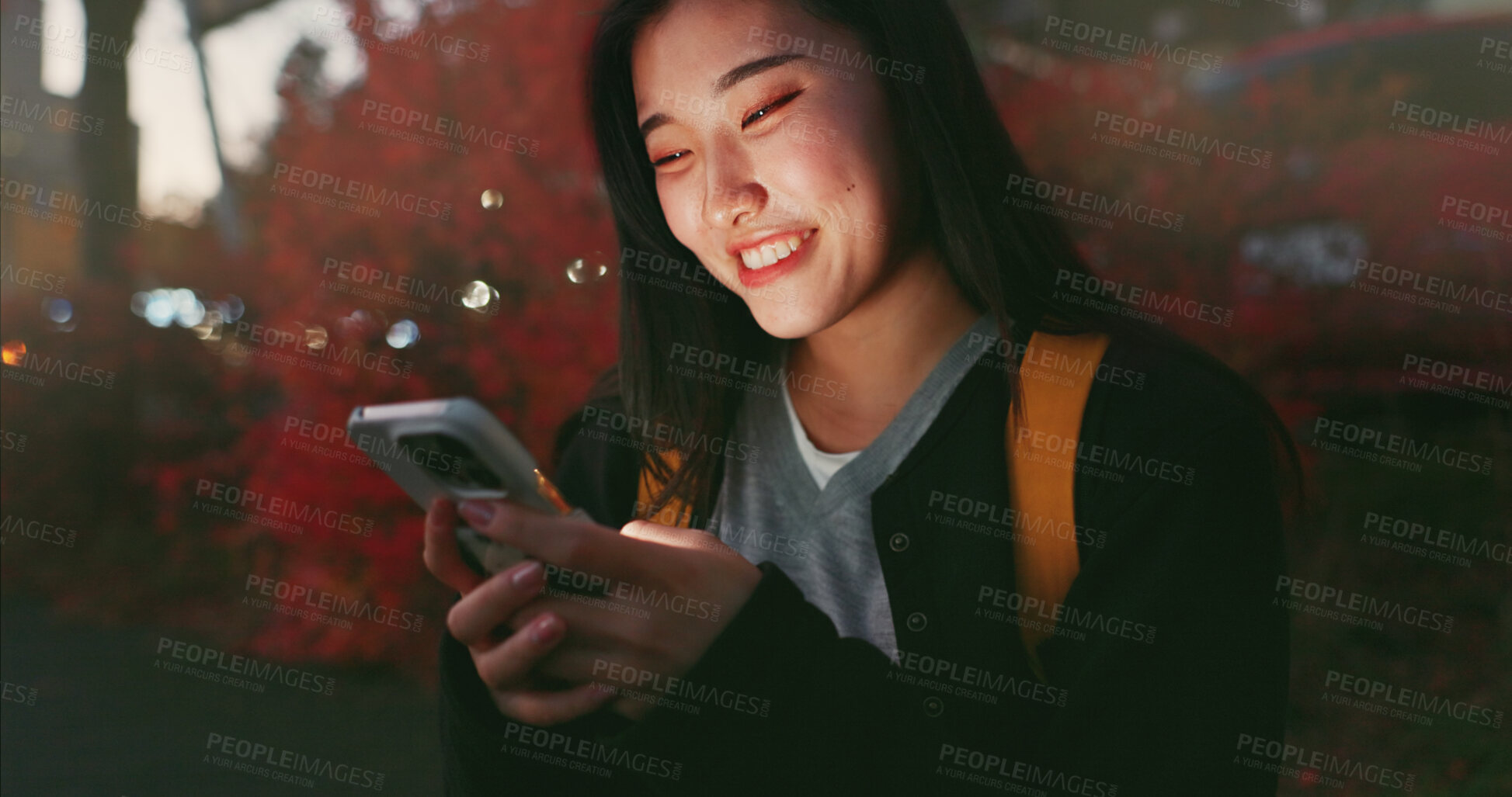Buy stock photo Happy asian woman, phone and night at city for social media, communication or outdoor networking. Female person smile on mobile smartphone in late evening for online chatting in urban town of Japan
